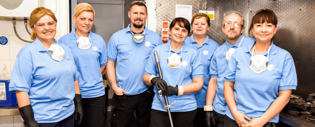 Team photo in kitchen
