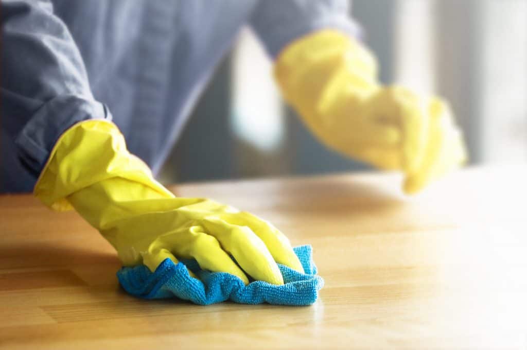 Woman,In,Protective,Yellow,Gloves,Cleaning,And,Wiping,Dust,In