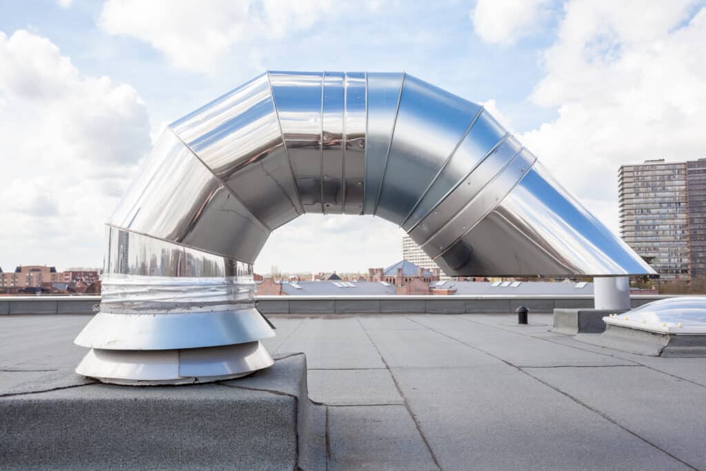 Inox,Chimney,On,The,Flat,Roof,In,The,City